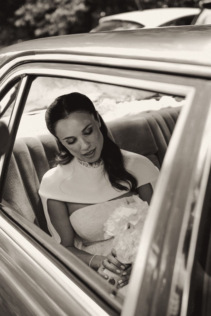 Bride arriving in a vintage car